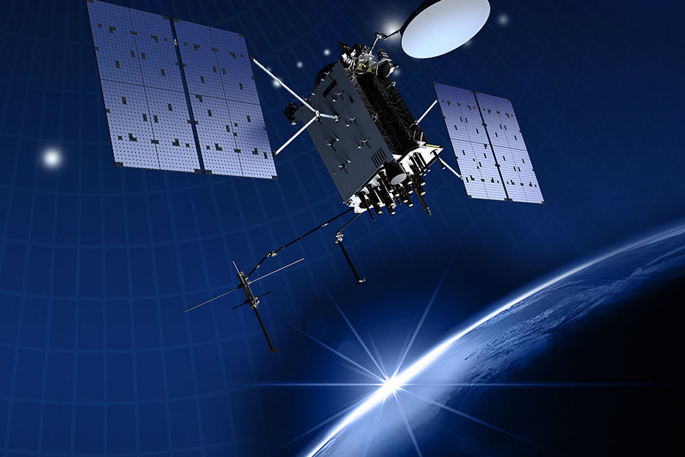 U.S. Space Force Guardian working beside a large ground communications antenna